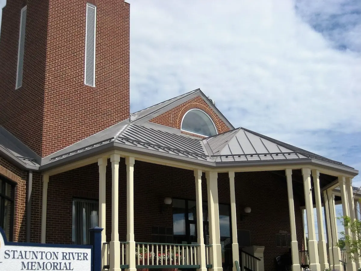 Skilled roofing craftsmen working on a residential roof in Thomaston